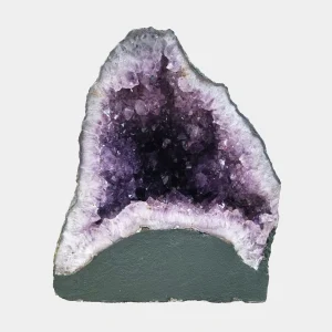 Front view of the 28 cm Amethyst Cathedral revealing vibrant violet crystals framed by light quartz and smooth basalt base.