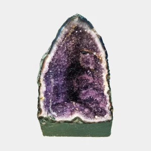 Front view of the 35 cm Amethyst Cathedral revealing rich violet crystals framed by white quartz and smooth basalt edges.