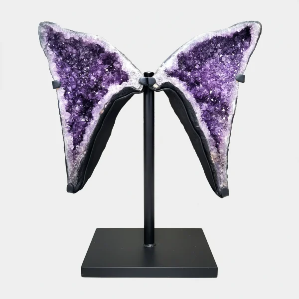 Front view of a large twin-wing Amethyst formation on a black metal stand with vivid purple crystals.