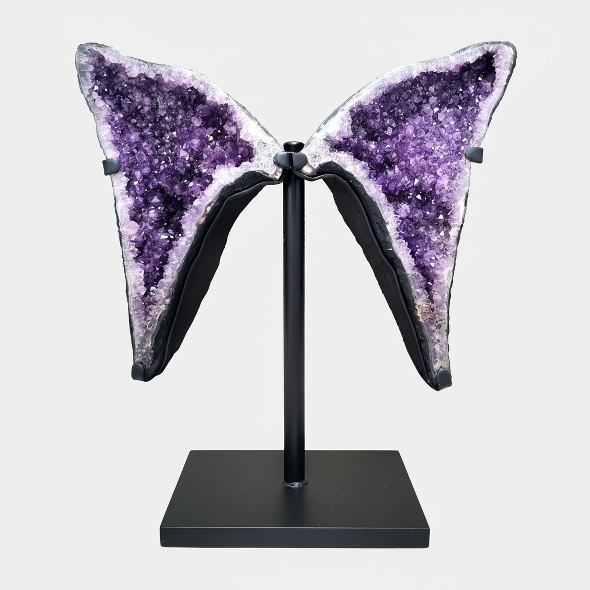 Amethyst Statement Piece N°3 – 81 cm – Front View Front view of a large twin-wing Amethyst formation on a black metal stand with vivid purple crystals.