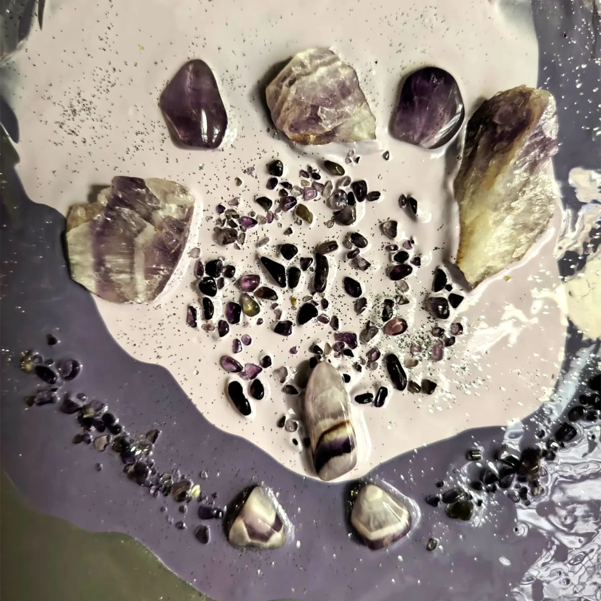 Surface detail with shimmering lilac texture and embedded amethyst fragments
