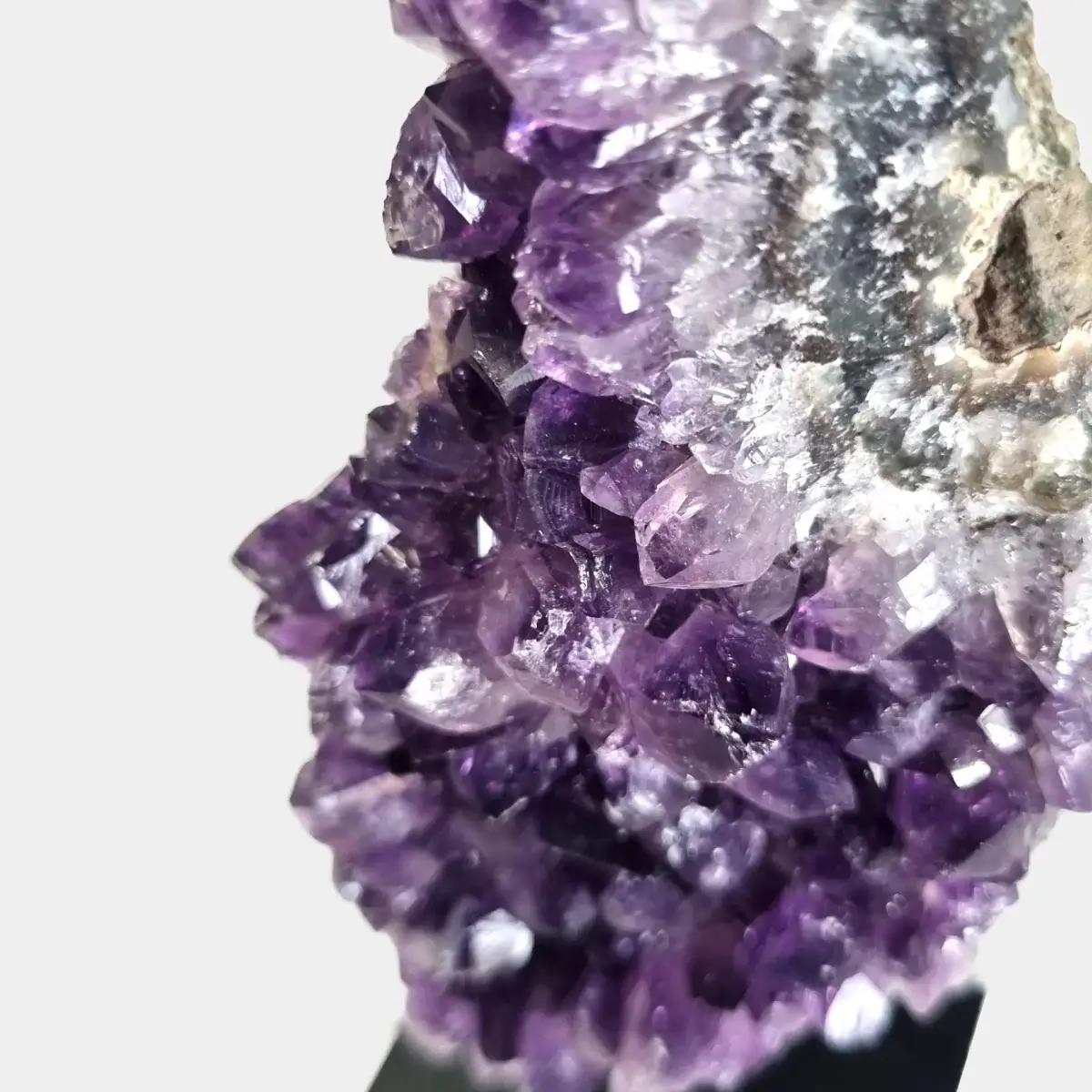 Close-up of violet amethyst crystal points in an amethyst cluster.