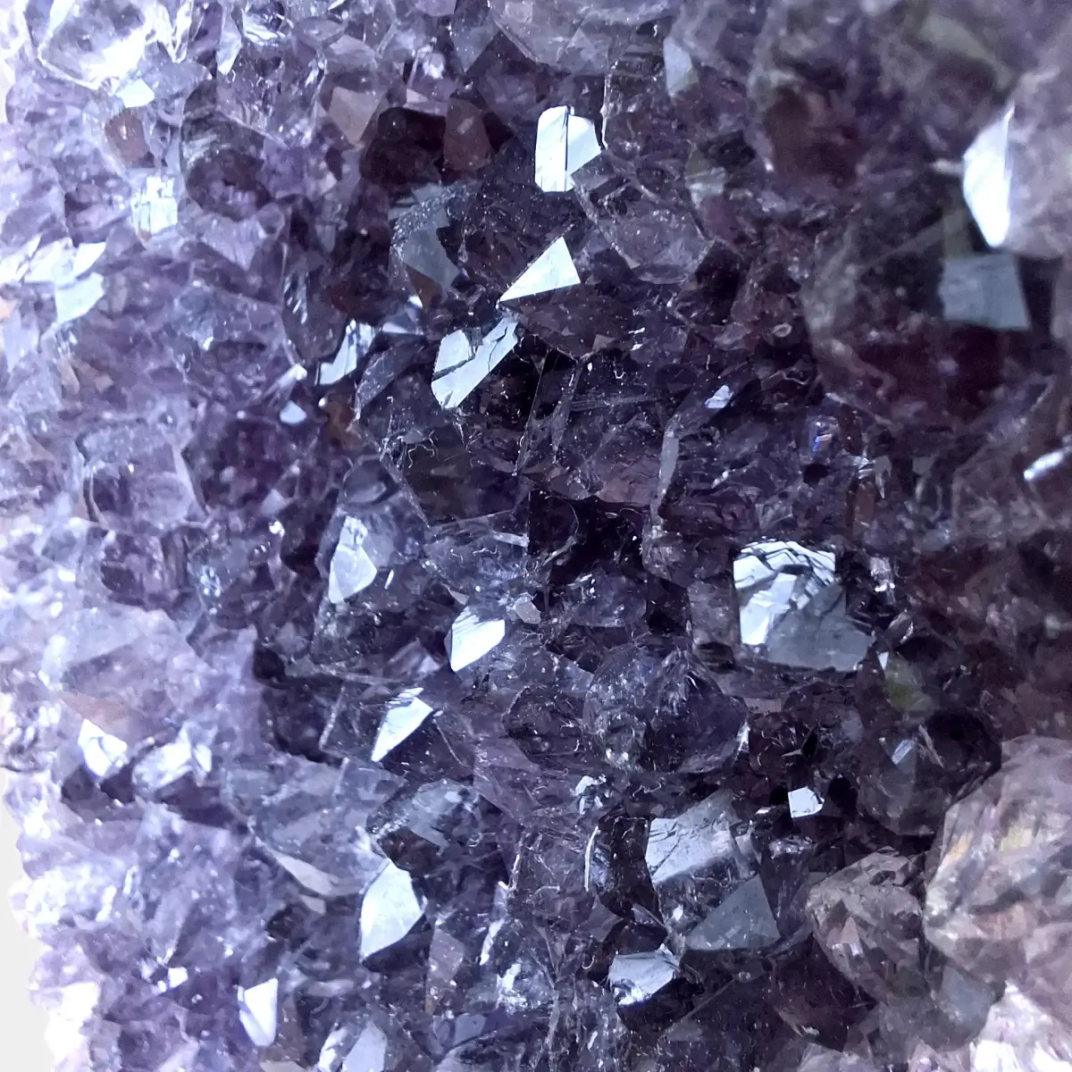 Close-up of pale violet amethyst crystal points in an amethyst cluster.