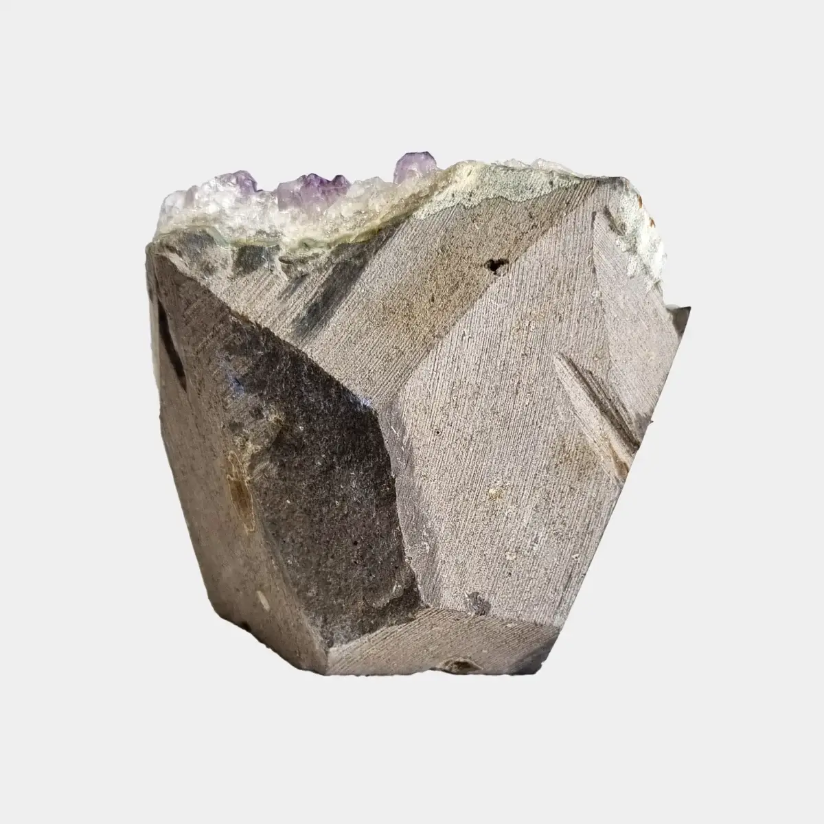 Back view of a small amethyst geode showing the cut natural stone exterior.