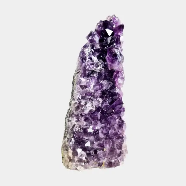 Front view of a small amethyst geode with dark violet crystals and a tall natural shape.
