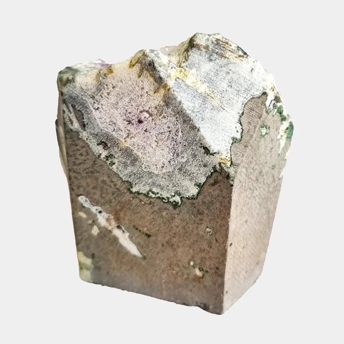 Back view of a small amethyst geode showing the cut natural stone exterior.